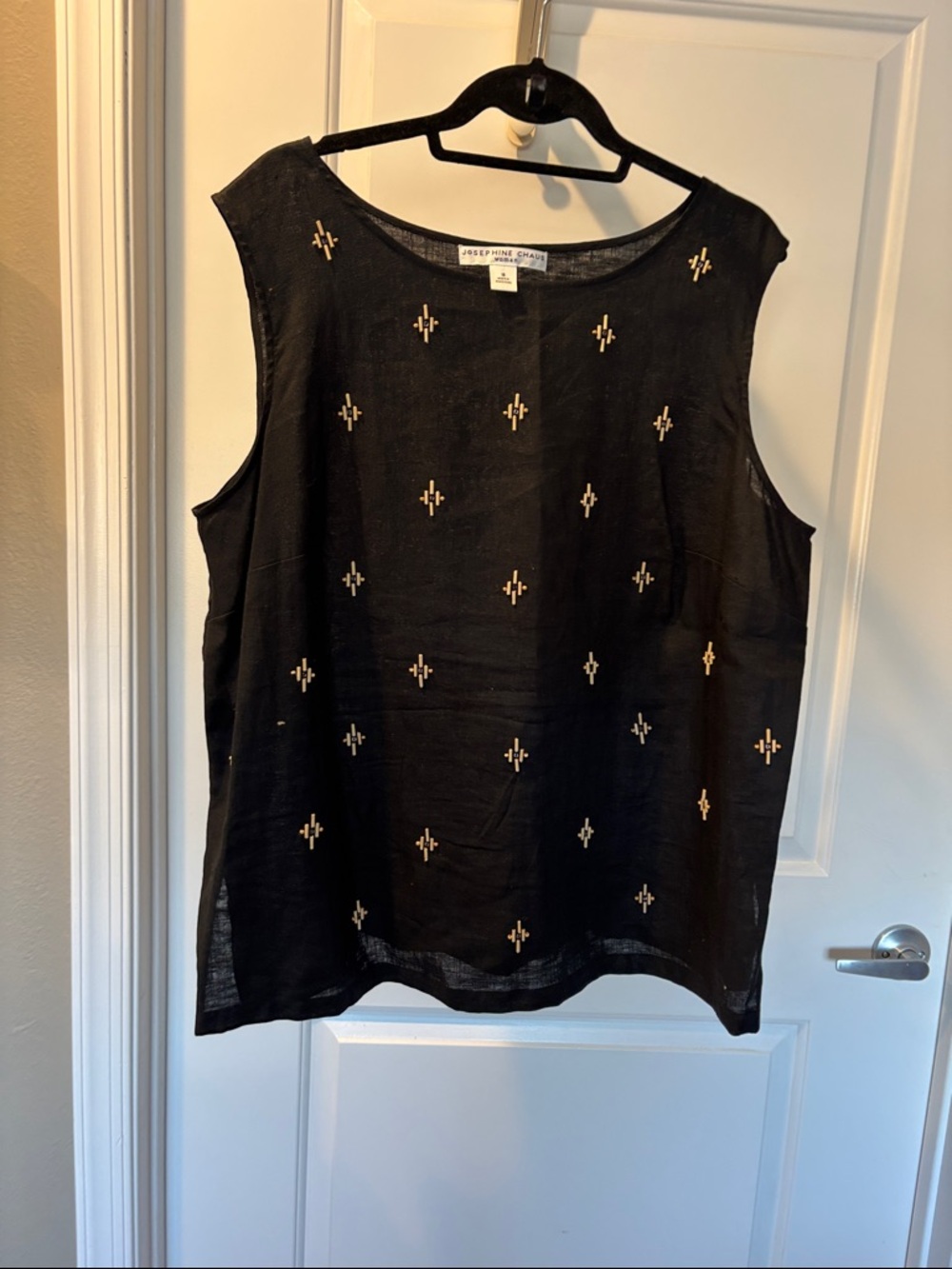 Josephine Chaus Black Sleeveless Top with wooden adornments.